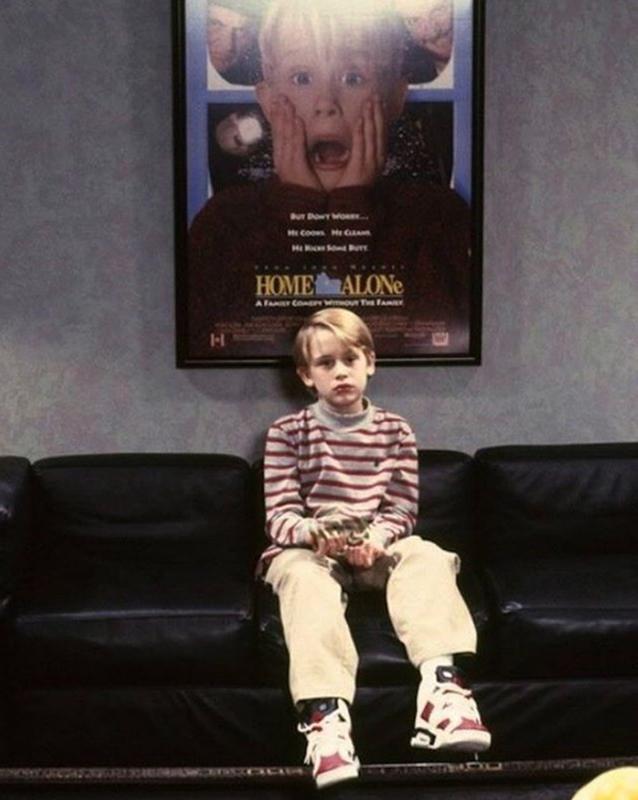 Macaulay Culkin With A Home Alone Poster
