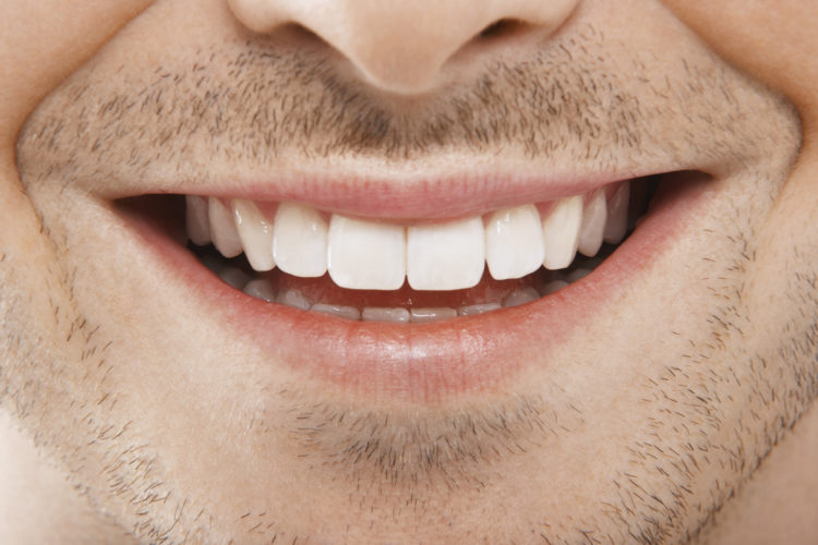 Detailed Image Of Young Man Smiling With Perfect White Teeth