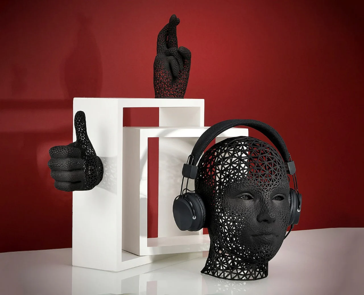 The Designs Feature A Human Head And Hands